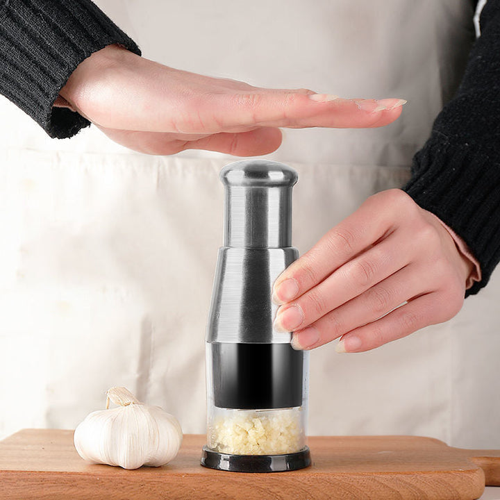 Stainless steel garlic press kitchen tool for quick meal prep & efficient cooking.