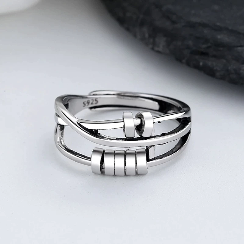 Sterling silver unisex fidget ring with dual spinning bands for anxiety & stress relief. A stylish spinner ring.