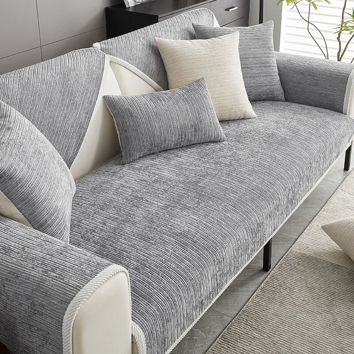 Durable anti-scratch chenille sofa cover. Protects living room furniture from pet claws & wear.