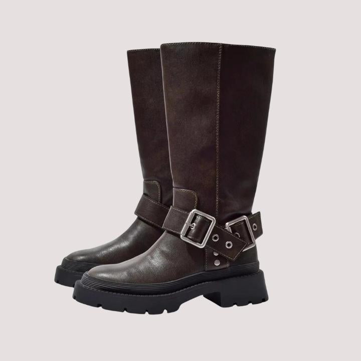Stylish brown women's knee-high boots with buckle straps. Perfect versatile fashion footwear for autumn and winter.