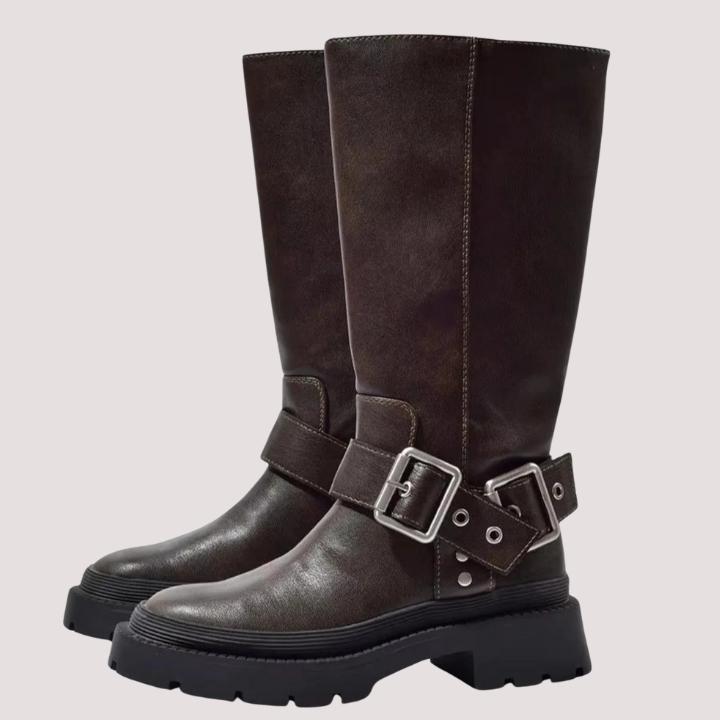 Elegant women's knee-high boots in brown, featuring chic buckle straps. Comfortable and fashionable for any occasion.