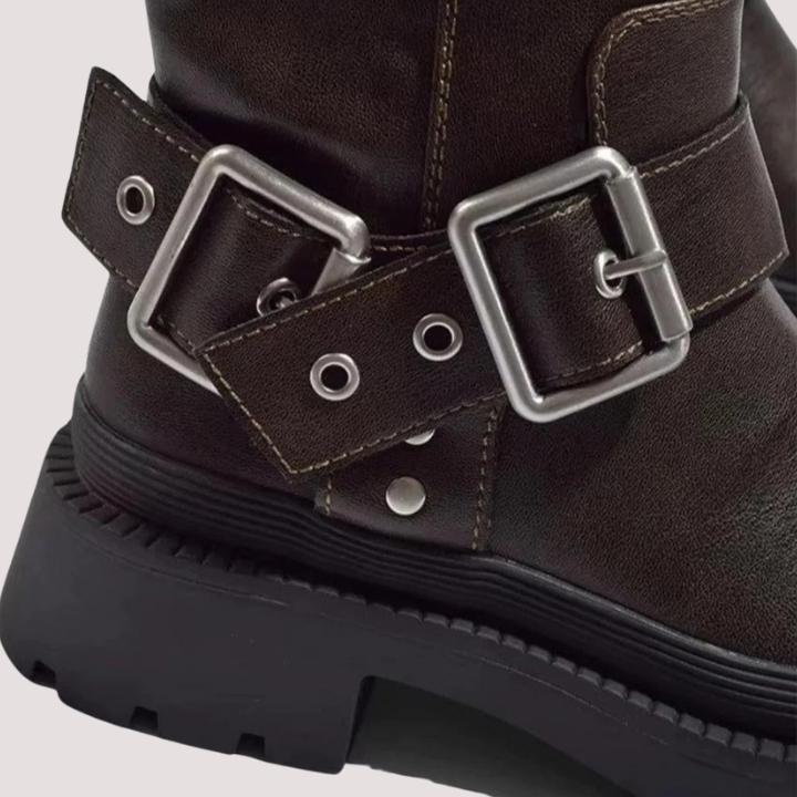 Versatile brown knee-high boots for women with decorative buckle straps. Essential fashion footwear for cold weather.