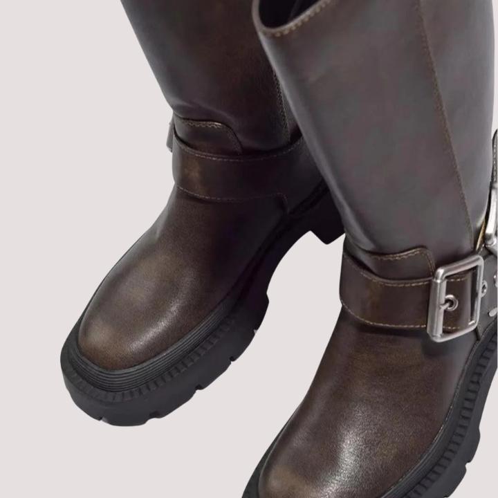 Women's comfortable brown knee-high boots with multiple buckle straps, ideal for stylish autumn and winter outfits.