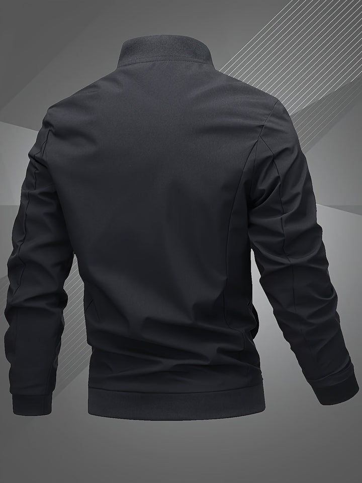 Stylish men's bomber jacket in a neutral color, open over a t-shirt, for a relaxed fashion look.