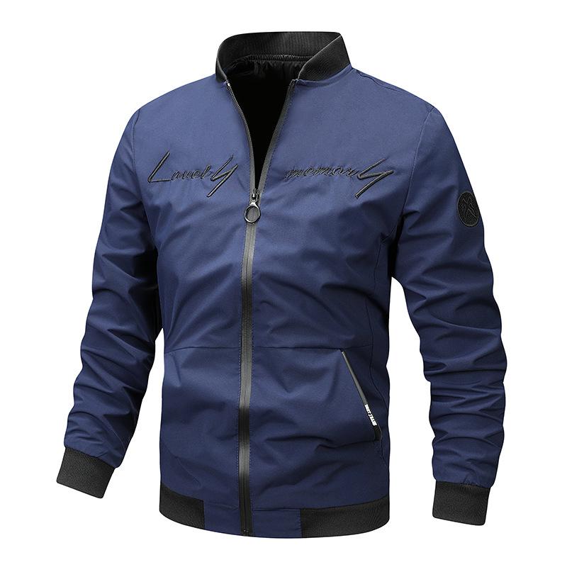 Detail of the ribbed collar and hem of a men's black bomber jacket, a key menswear fashion item.