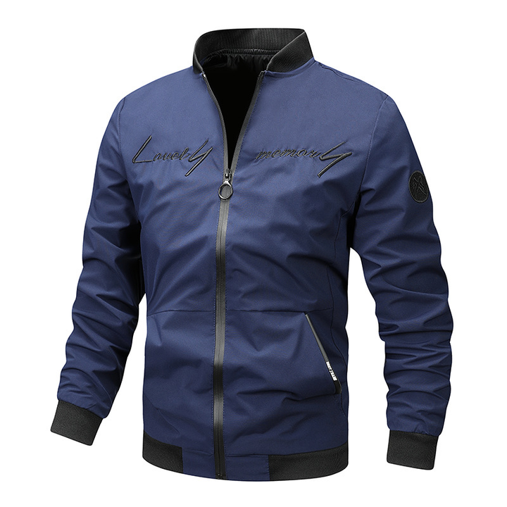 Detail of the ribbed collar and hem of a men's black bomber jacket, a key menswear fashion item.