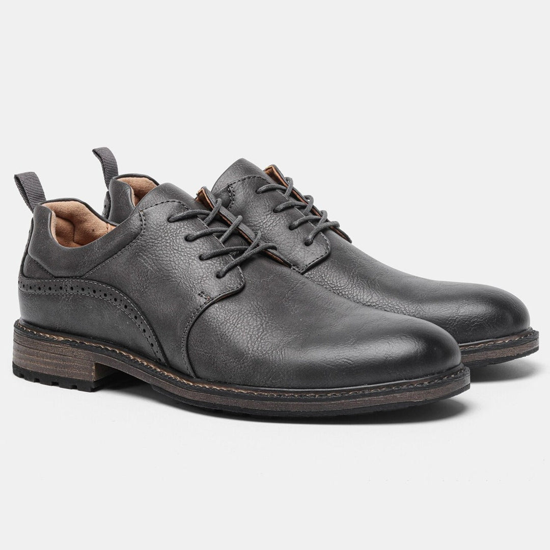 Premium men's dark grey booties, crafted for exceptional comfort and style with a reliable non-slip sole.