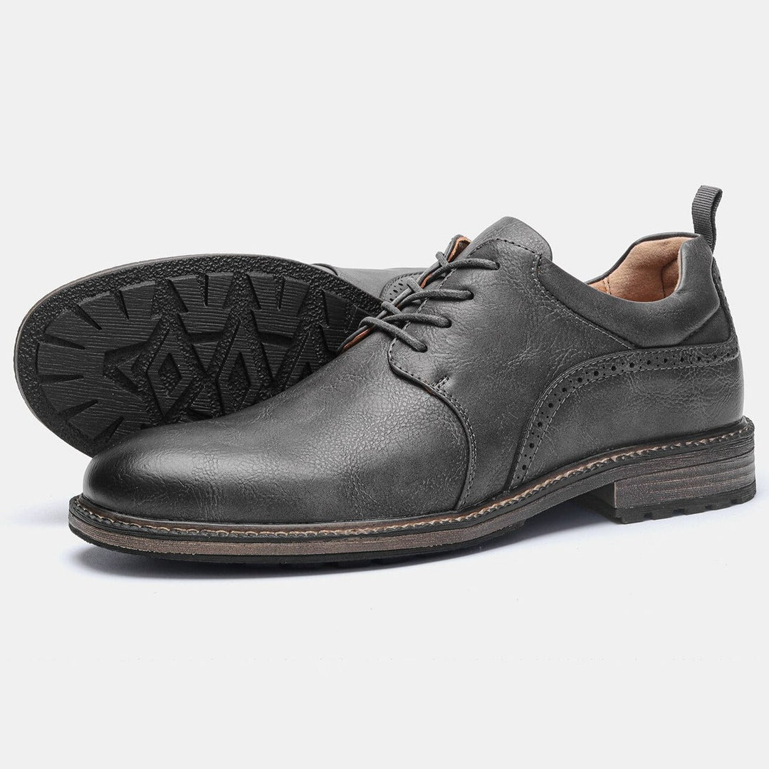 Men's dark grey stylish booties with robust non-slip grip and premium comfort, ideal for daily wear.