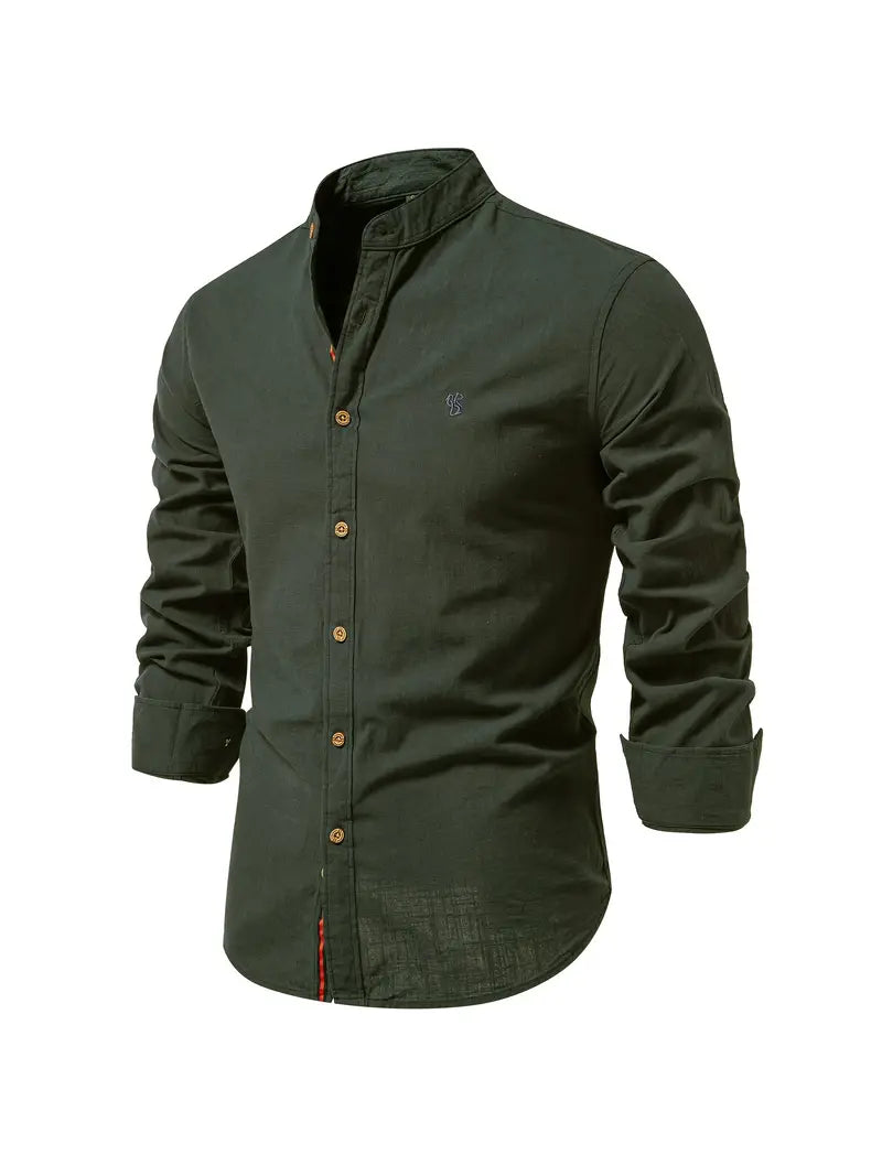Man wearing a stylish men's casual button-up shirt with sleeves rolled, showcasing versatile modern fashion.
