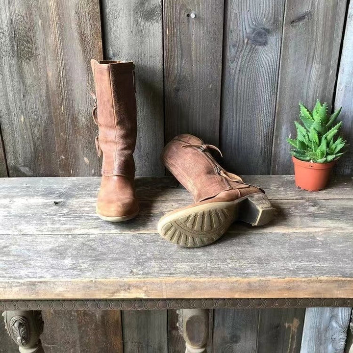 Women's stylish brown mid-calf boots with low heel, ideal for autumnal outfits