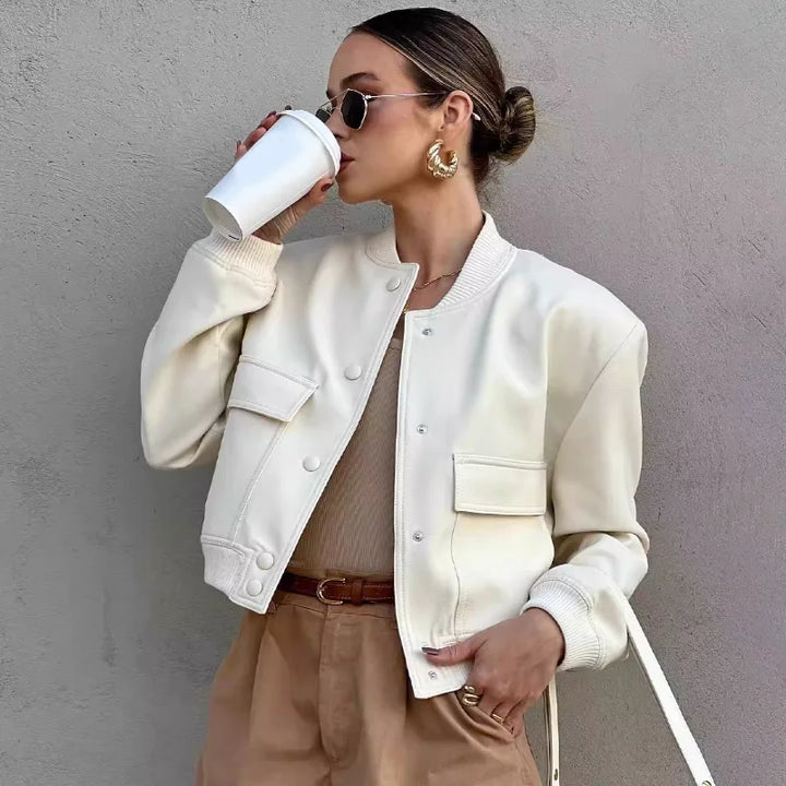 Stylish women's button-front cropped jacket in a versatile solid color, perfect for spring fashion.