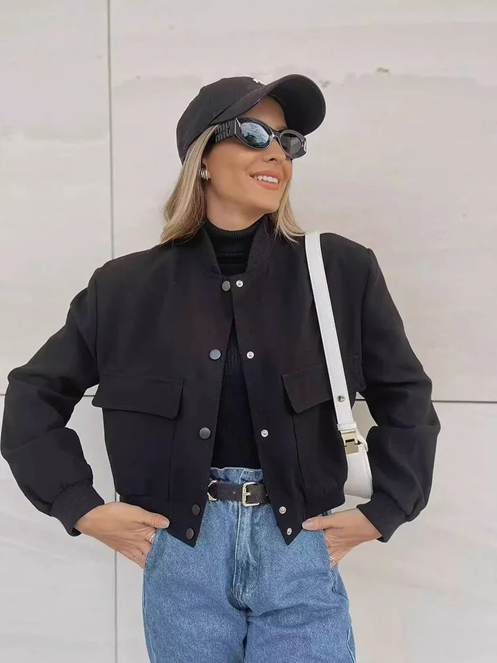 Front view of a women's button-front cropped jacket, showcasing its clean design and buttons.