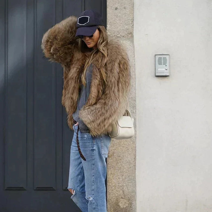 Stylish women's cropped winter jacket, perfect for chic evening wear or adding effortless glamour to any look.