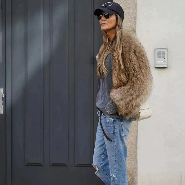 Modern women's cropped outerwear for winter, offering effortless glamour and a chic, stylish appearance.
