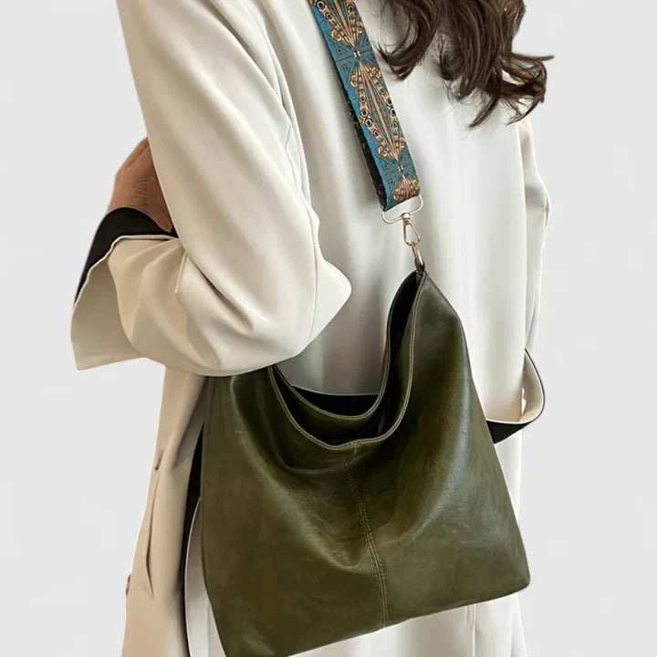 Elegant women's crossbody bag, ideal for daily essentials, featuring a chic and practical design.