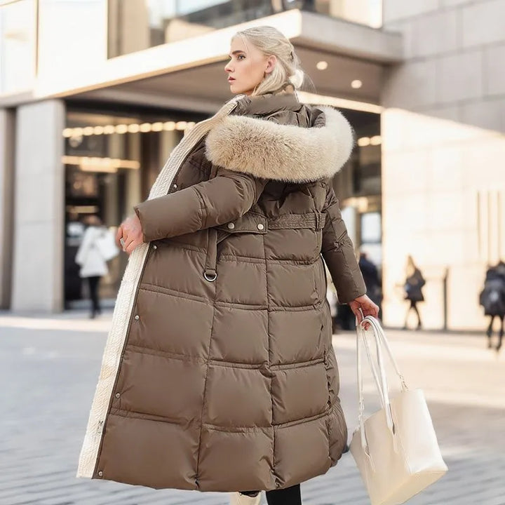Premium women's long winter coat, fur hood, and belt. Combines warmth, style, and cold weather comfort.