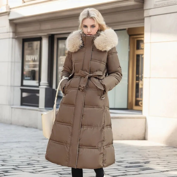 Warm women's long winter jacket with a cozy fur hood & fashionable belt. Ideal for cold weather.