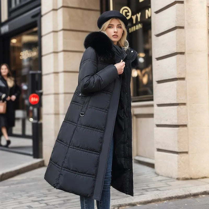 Fashionable women's long winter jacket with a luxurious fur hood and a flattering belted design.