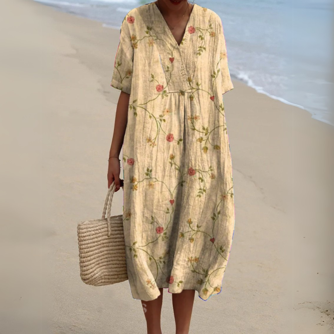 Women's elegant multicolour V-neck midi dress, flowy floral pattern for summer.