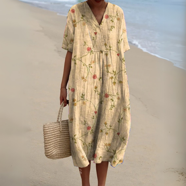 Women's elegant multicolour V-neck midi dress, flowy floral pattern for summer.