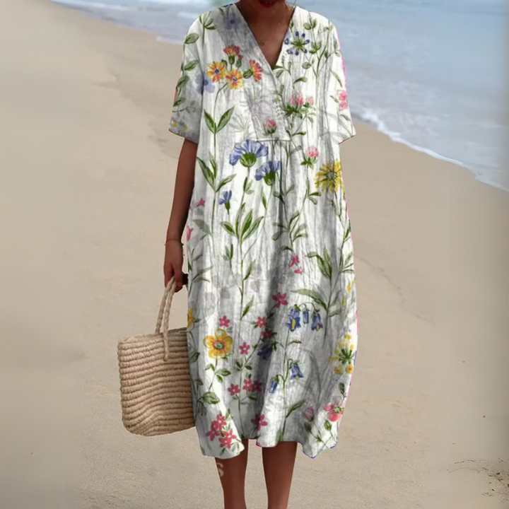 Women's casual multicolour V-neck summer dress, stylish floral midi, perfect for warm days.