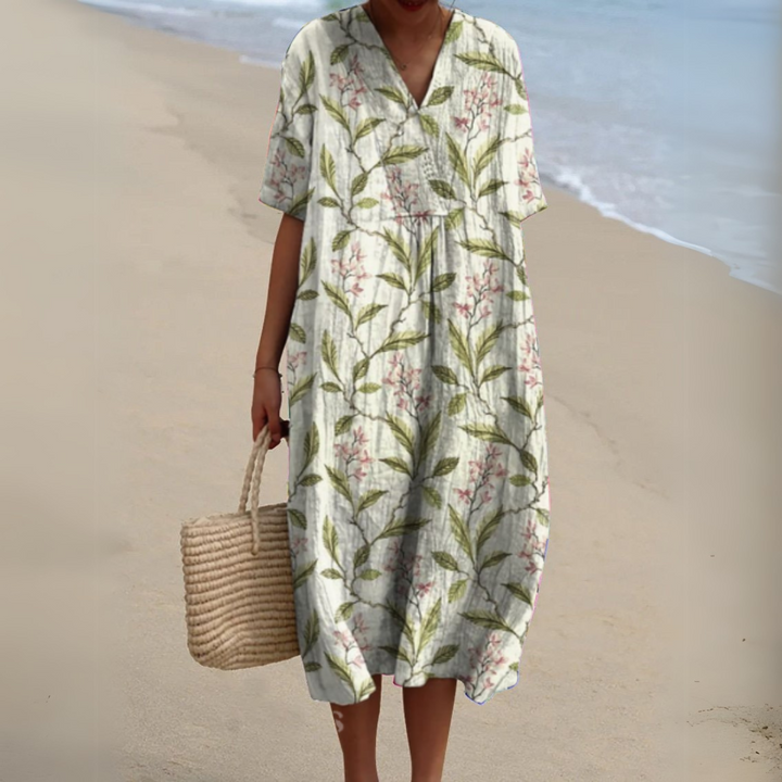 Vibrant multicolour V-neck summer dress, women's floral midi perfect for vacation.