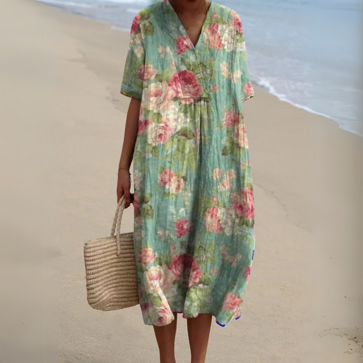 Chic women's multicolour floral V-neck dress, elegant and flowy for summer days.