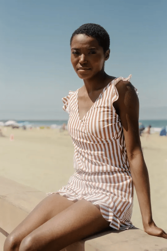 Sleek black women's one-piece swimsuit, providing supportive swimwear and a timeless summer look.