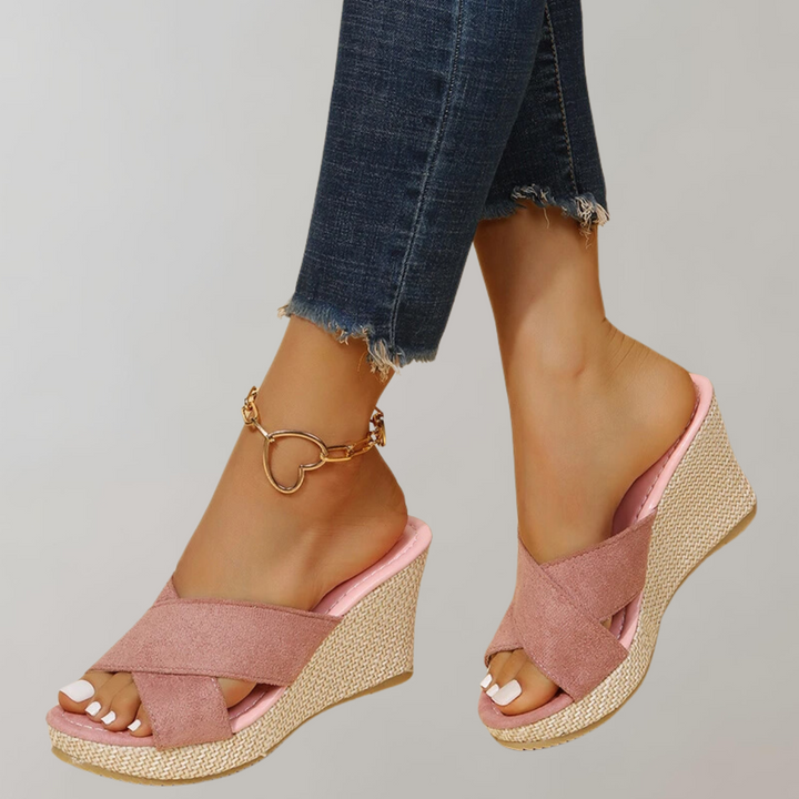 Stylish women's orthopedic wedge sandals with crisscross straps, offering comfortable foot support for summer.