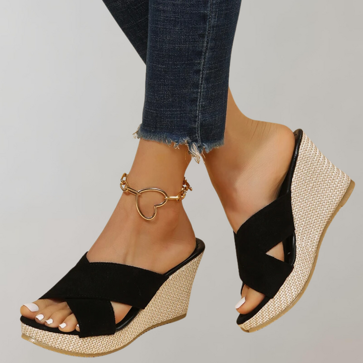 Chic women's crisscross wedge sandals; orthopedic support ensures comfort, ideal for elegant casual summer outfits.