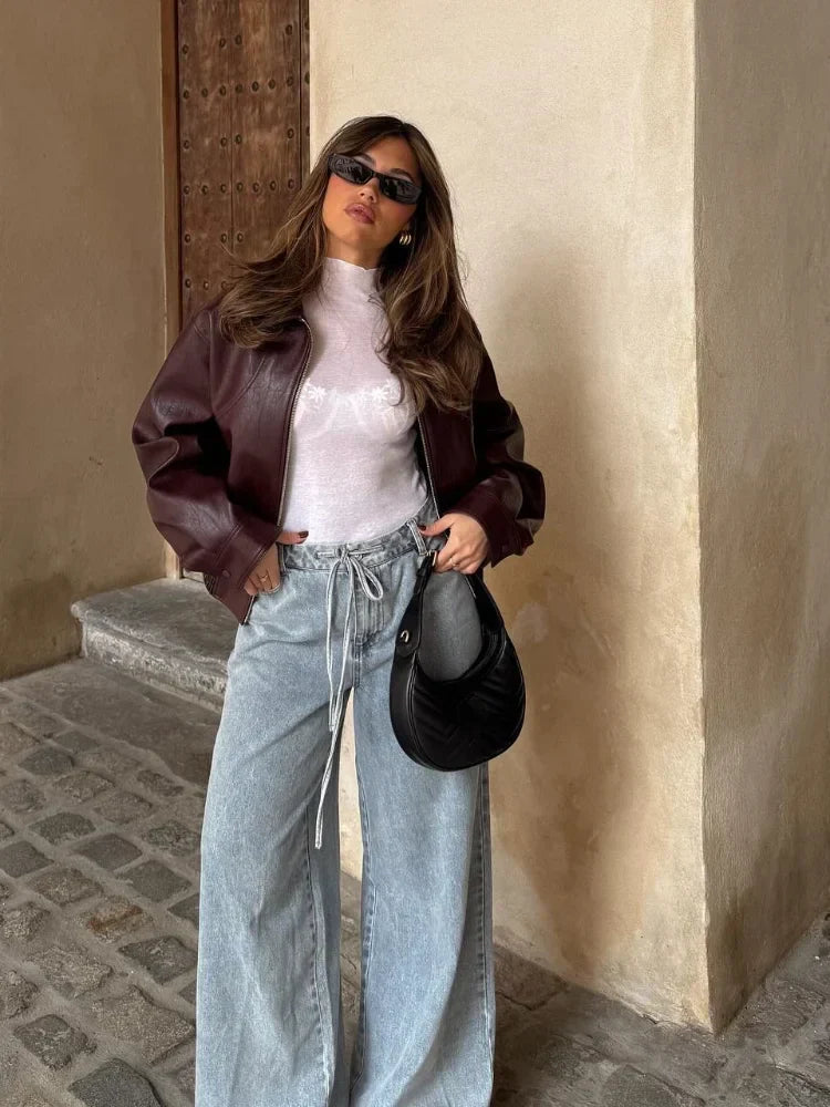 Chic women's oversized leather fashion jacket, waist-length cut for a modern look. Great outerwear for women.