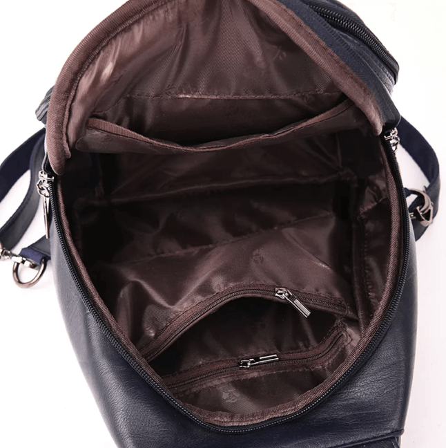 Women's water-resistant leather travel backpack, designed for style and security.
