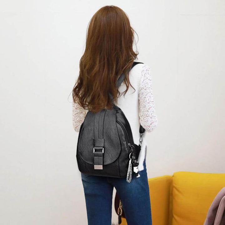 Anti-theft water-resistant leather backpack for women, a secure & stylish work bag.