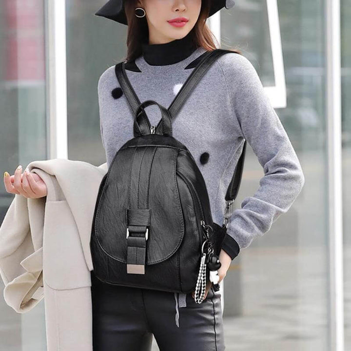Stylish water-resistant genuine leather backpack for women, a versatile daily fashion accessory.