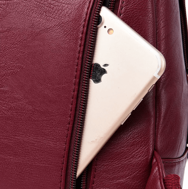 Fashionable women's water-resistant leather backpack, a versatile work and travel bag.