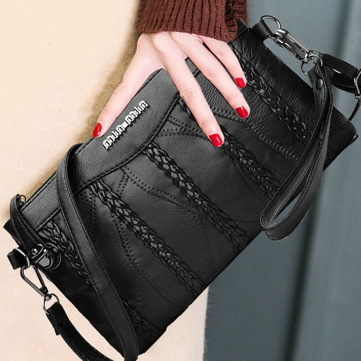 Fashionable women's PU leather crossbody bag. Elegant clutch & shoulder bag for day or evening use.