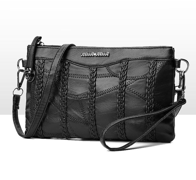 Chic PU leather women's crossbody clutch. Modern handbag design, a versatile fashion accessory.