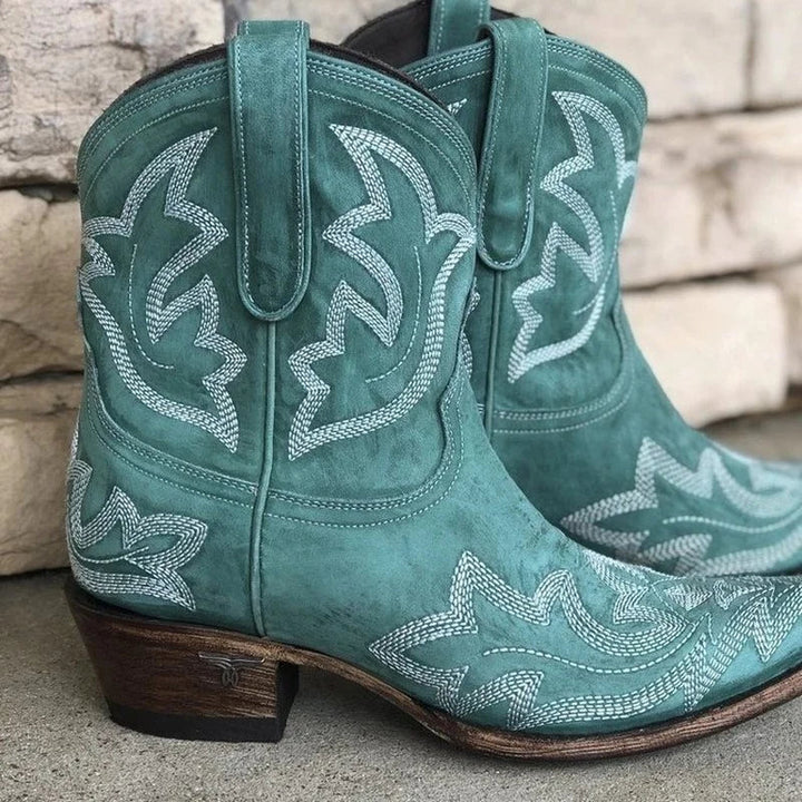 Fashionable women's embroidered red cowboy boots. Western style footwear offering comfort for autumn & winter.