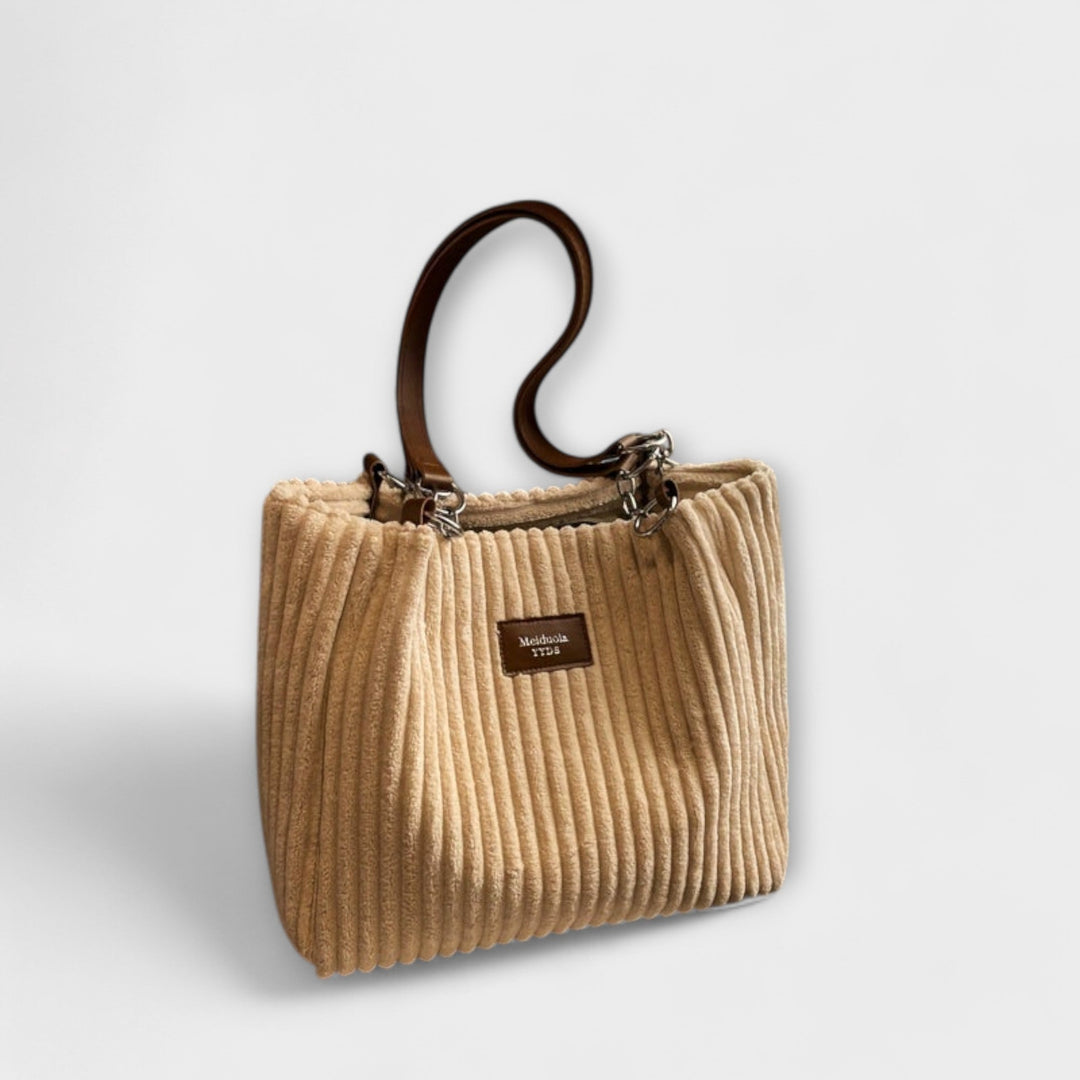 Close-up of a women's shoulder bag made from comfortable and stylish corduroy fabric