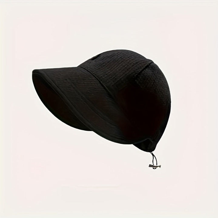 Chic women's summer hat, wide brim, and adjustable drawstring, ideal fashion accessory for sun protection & travel.