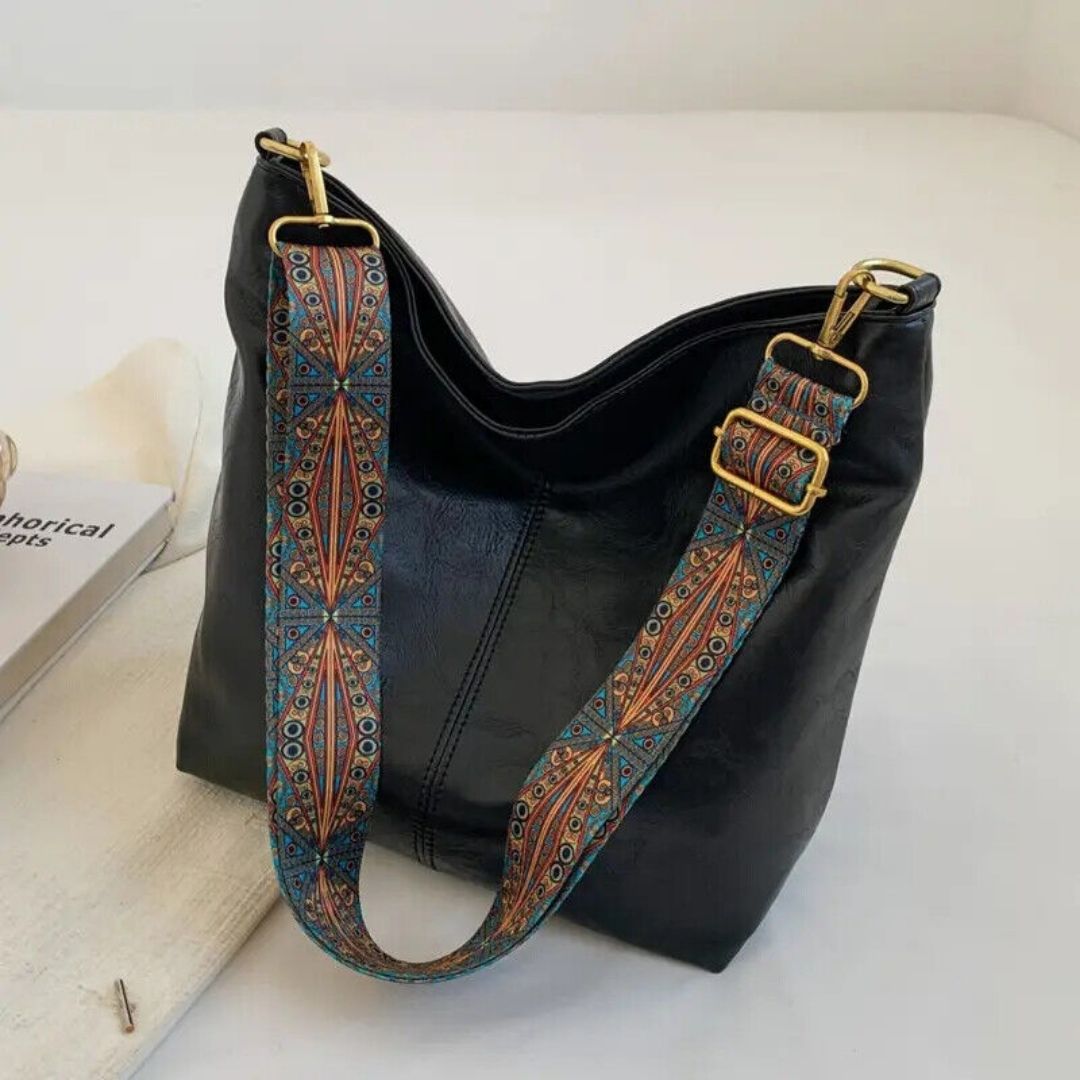 Elegant women's fashion tote bag with stylish design, decorated straps, and a roomy compartment for daily use.