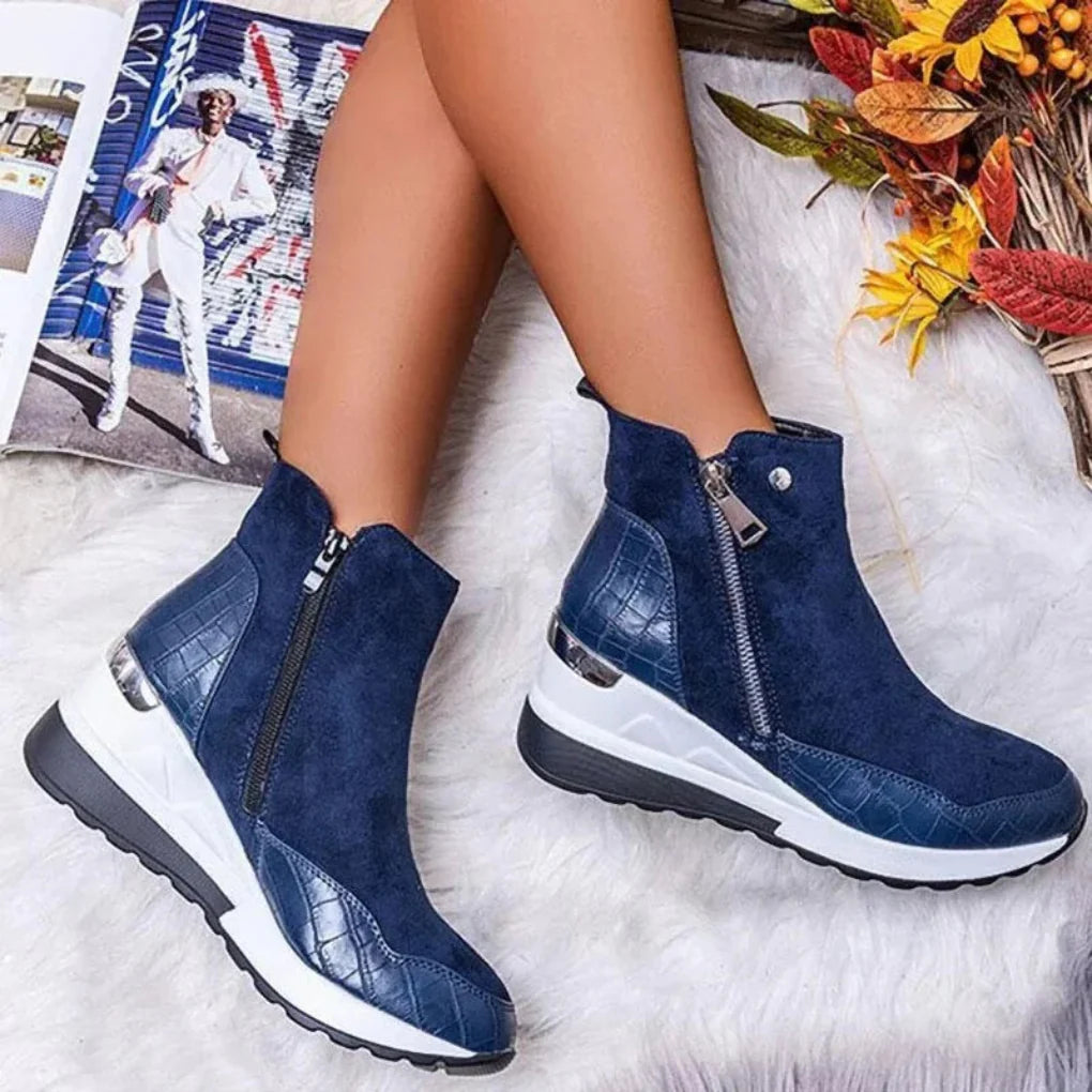 Pair of women's waterproof ankle boots with clean lines, blending urban style and practical non-slip features.