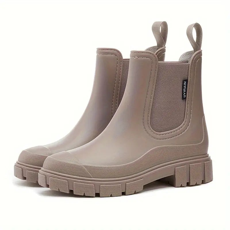 Stylish women's waterproof rain ankle boots, perfect for wet weather fashion & outdoor comfort. Non-slip design.