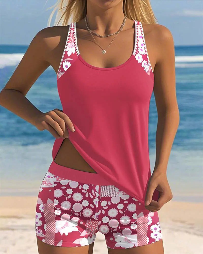 Women's two-piece tankini set with floral shorts and adjustable straps for summer. (80 characters)