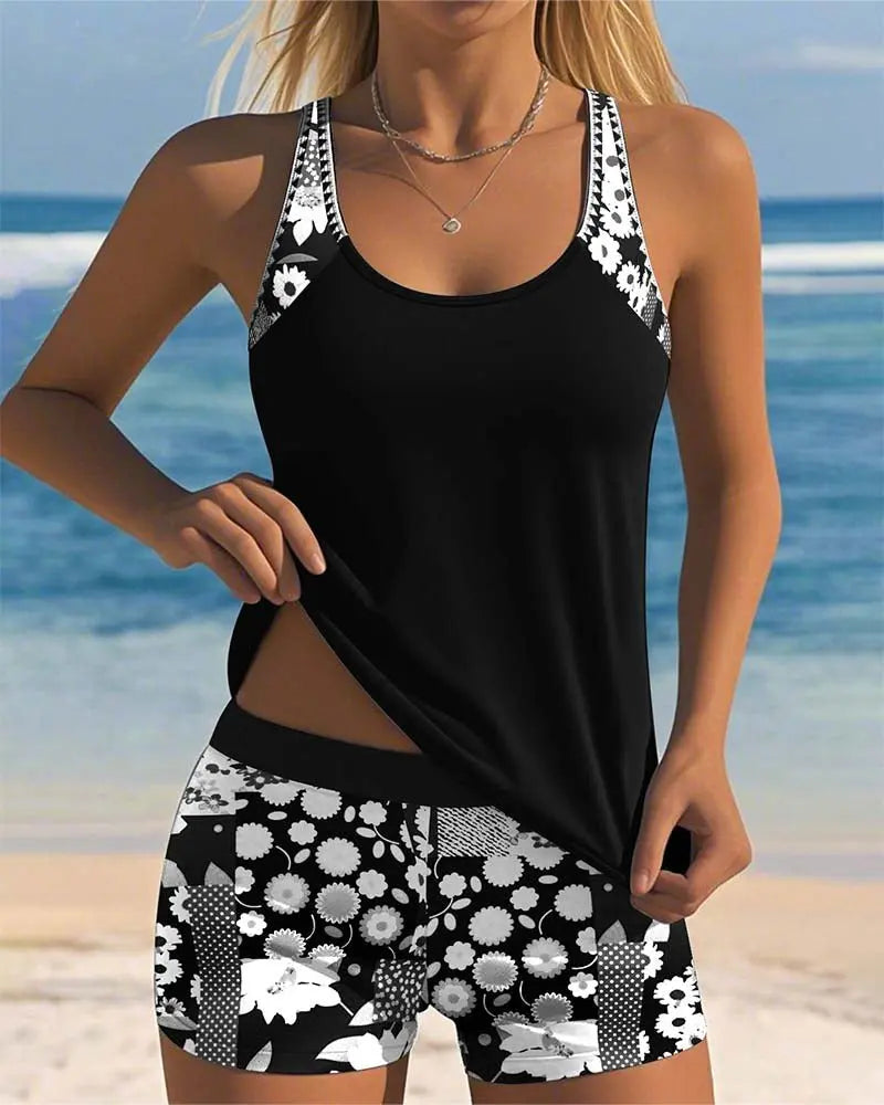 Stylish women's floral print tankini with swim shorts, a comfortable two-piece for summer. (99 characters)