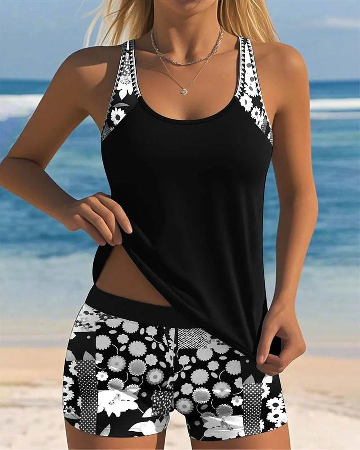 Stylish women's floral print tankini with swim shorts, a comfortable two-piece for summer. (99 characters)