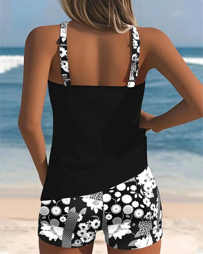 Women's modest tankini set, ideal for swimming & beach activities, featuring floral shorts. (96 characters)