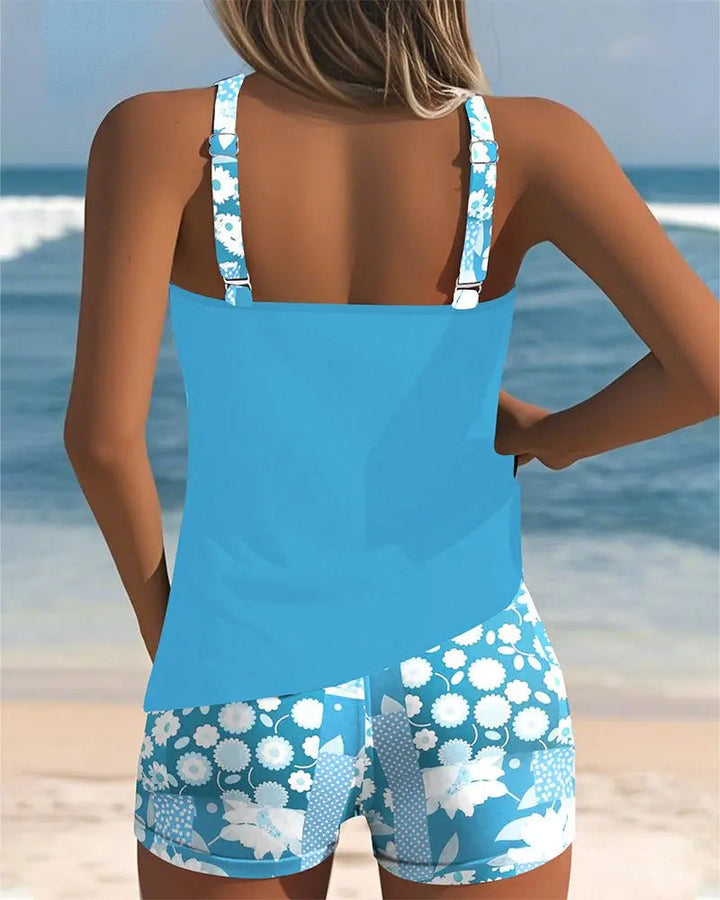 Elegant women's two-piece floral tankini, a flattering modest swimsuit with shorts. (86 characters)
