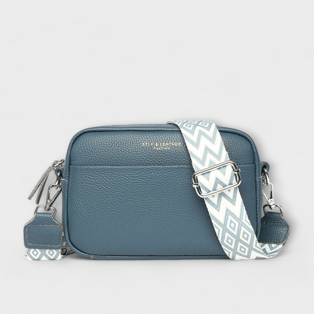 Textured crossbody mini shoulder bag for women with statement strap, a versatile everyday fashion accessory.