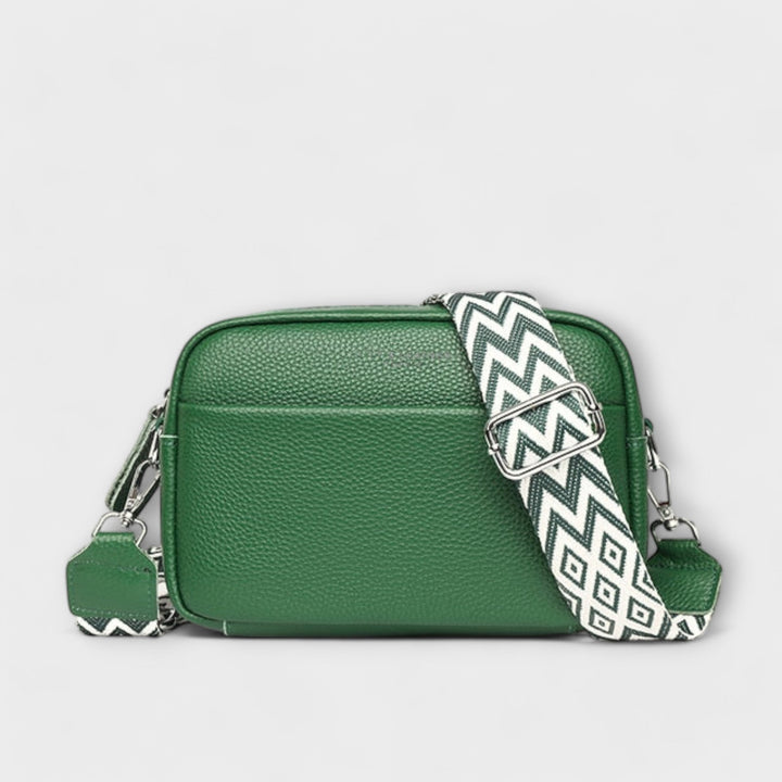 Elegant women's mini shoulder bag, textured design with a unique statement strap, a fashionable crossbody.